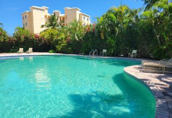 Gated waterfront condo with boat dock and view has rooms with a private hot tub