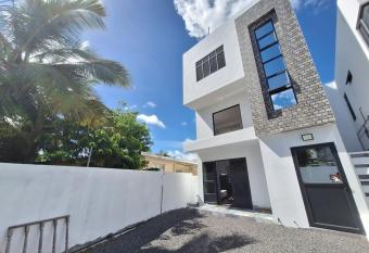 Grand Baie Apartment has rooms with a private hot tub