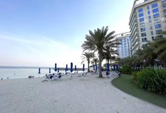 Sea-View Studio with Beach Access has rooms with a private hot tub