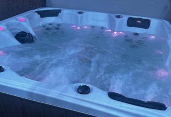 The Beach House has rooms with a private hot tub