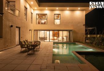 StayVista s The Sweet Life - Farm-View, Pet-Friendly Villa with Outdoor Pool, Terrace & Fireplace has Balcony rooms