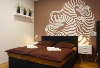 Atrium Apartments has rooms with a private hot tub