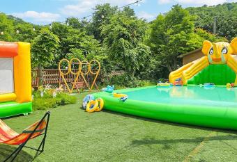 Ganghwado Baby Bear Spa Pension has rooms with a private hot tub