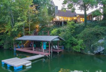 Relax in this 4BR 3BA Boone Lake front cottage has rooms with a private hot tub