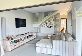 Modern Beachfront Home allows 18 year olds to book a room