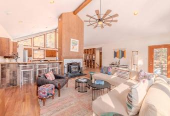 Grand Angel Fire mountain luxury ski chalet has rooms with a private hot tub