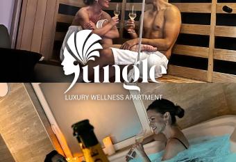 JUNGLE Wellness Apartment has rooms with a private hot tub