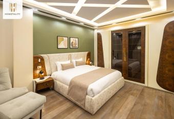 Homztality Zayed Apartments has rooms with a private hot tub