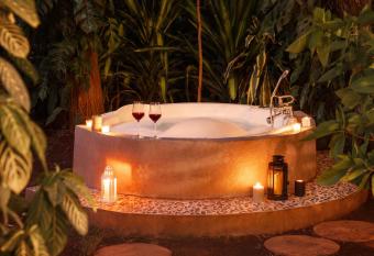 Stay Leisurely Peace Lily Cottage Jacuzzi 2BHK, Karjat has rooms with a private hot tub