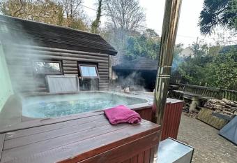 The hot tub by the waterfall - fully inclusive has rooms with a private hot tub