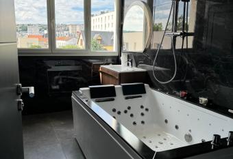 appartement jacuzzi has rooms with a private hot tub