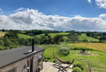 A luxury lodge, log burner and incredible views has rooms with a private hot tub