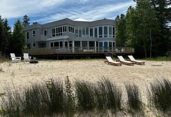 Stunning Beachfront Retreat, Sleeps 12 has Balcony rooms