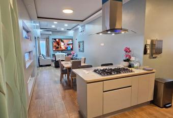 Your private paradise close by the beach! has rooms with a private hot tub