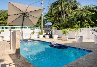 Steps from the beach, private pool, AC, allows 18 year olds to book a room