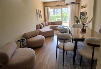 Luxerious apartment with a private garden and pool access has rooms with a private hot tub