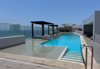 Spectacular beachfront apt luxury amenities has rooms with a private hot tub