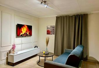 Modern Apartment in Randburg has rooms with a private hot tub