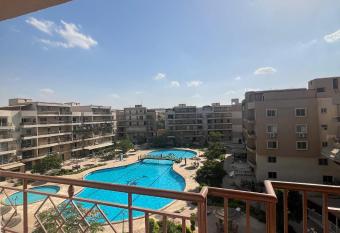 Apartment in Pearl Pyramids Compound has Balcony rooms