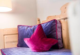 Mirabell Dolomites Hotel Luxury Ayurveda & Spa has rooms with a private hot tub