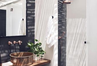 Cavo Tagoo Santorini has rooms with a private hot tub