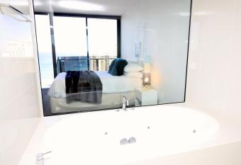 Cavill Avenue Luxury Private Apartments has rooms with a private hot tub