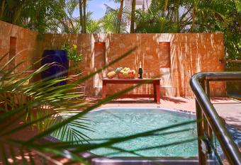 Beach Villas & Apartments Larimar has rooms with a private hot tub