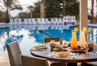 Astral Nirvana Suites- Half Board allows 18 year olds to book a room