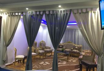 Private Family Apartment in Dokki has rooms with a private hot tub