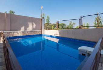 Grande Montana by StayVista - Luxurious Hillside Villa featuring Pool, Theater, and Games Room allows 18 year olds to book a room