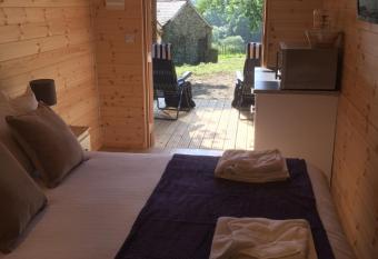 Romantic Getaway Luxury Wooden Cabin With Private Hot Tub and BBQ has Balcony rooms