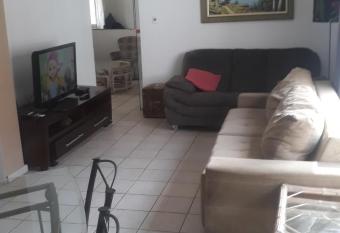 Guaruja ap lindo 200 m da praia has rooms with a private hot tub