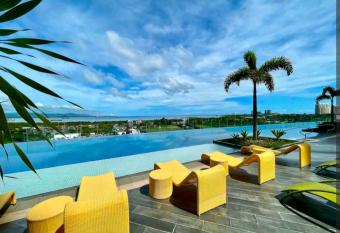 Condo in Mactan Newtown with pool and beach access has Balcony rooms
