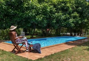 Nivaant Farms by StayVista - Green Retreat with Pool, Orchard, Jacuzzi & Gazebo allows 18 year olds to book a room