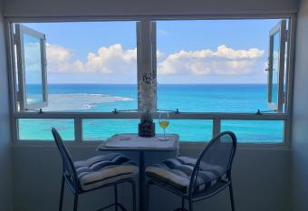 Breezy beachfront property with view of paradise allows 18 year olds to book a room