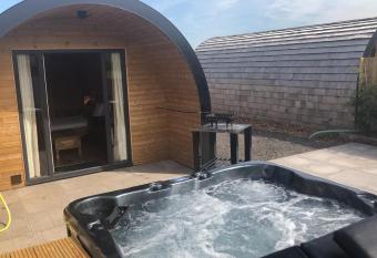 Superior glamping pod with hot tub has rooms with a private hot tub