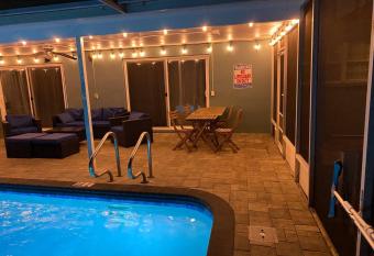 Spacious 5 bedroom 3 bathroom Family-Friendly Home With Heated salt Pool has Balcony rooms