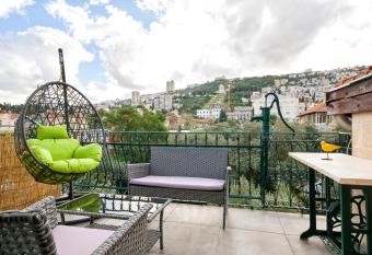 Panoramic views of the Bah      gardens, close to German colony allows 18 year olds to book a room