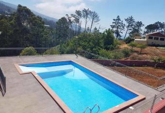 2 bedrooms appartement with shared pool furnished terrace and wifi at Prazeres 5 km away from the beach has Balcony rooms