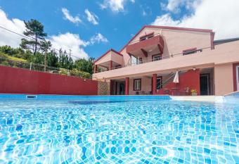 2 bedrooms appartement with shared pool furnished terrace and wifi at Prazeres 5 km away from the beach has Balcony rooms