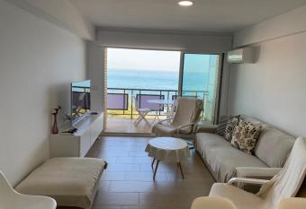   tico en primer  sima linea de playa!!! has Balcony rooms