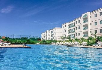 Flat Palm Village - Apt t  rreo, 2 quartos com ar-condicionado, frente para piscina - Porto de galinhas - PE has Balcony rooms