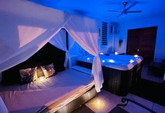 Private Oasis with Jacuzzi and Cabana Pet Friendly has rooms with a private hot tub