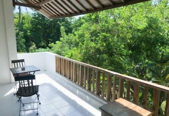 White House in Jungle Apartment has Balcony rooms