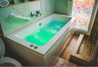 Kassandrou Suite HOT TUB-JAKUZZI - 2 BEDROOMS - BIG BALCONY - CENTER has rooms with a private hot tub