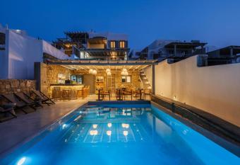 The Mykonist Merchia Beach Villas & Suites has rooms with a private hot tub