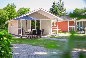 Beautiful lodge with dishwasher, located on a holiday park in Brabant has Balcony rooms