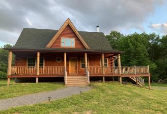 Spacious Luxurious Log Cabin Near Cooperstown Ny has rooms with a private hot tub