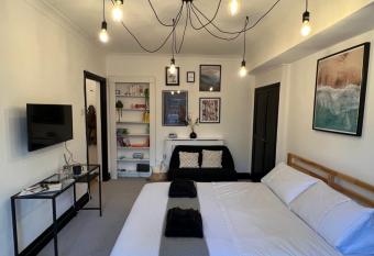 Stylish central basement studio, with outdoor space has Balcony rooms