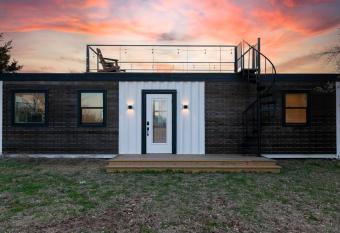 The Live Oak Tiny Container home near Magnolia allows 18 year olds to book a room